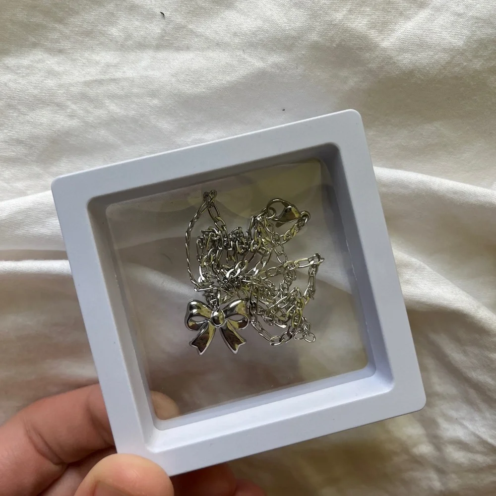 Stay Golden Stainless Steel Silver Bow Necklace - Picture 2 of 6